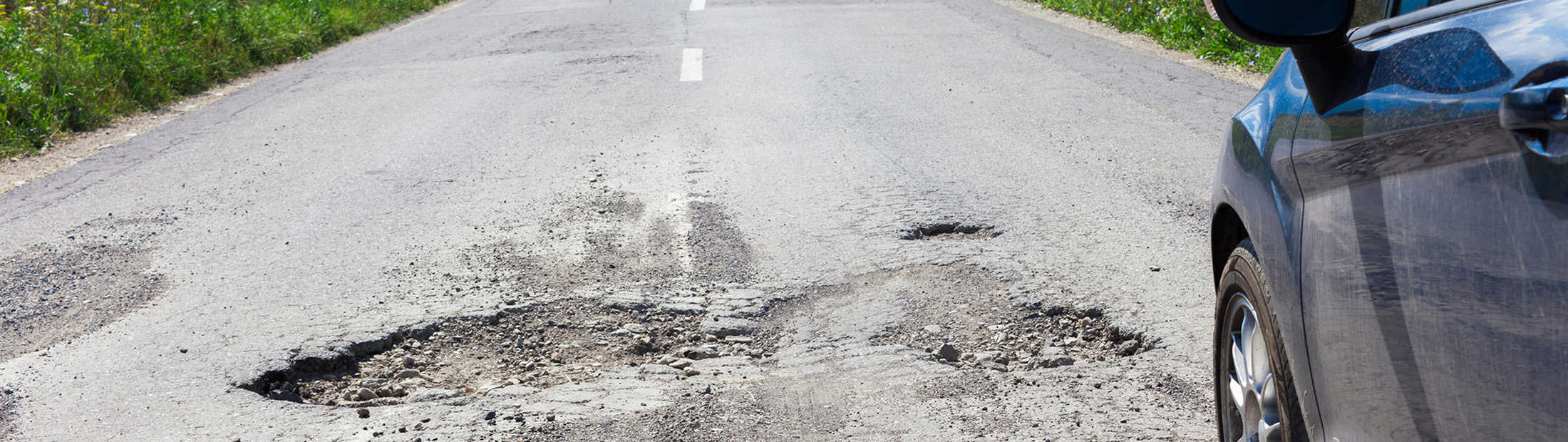 Featured image of road with potholes
