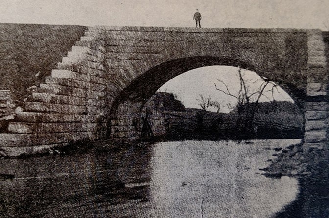 Frederick Pelham stands atop a skew bridge