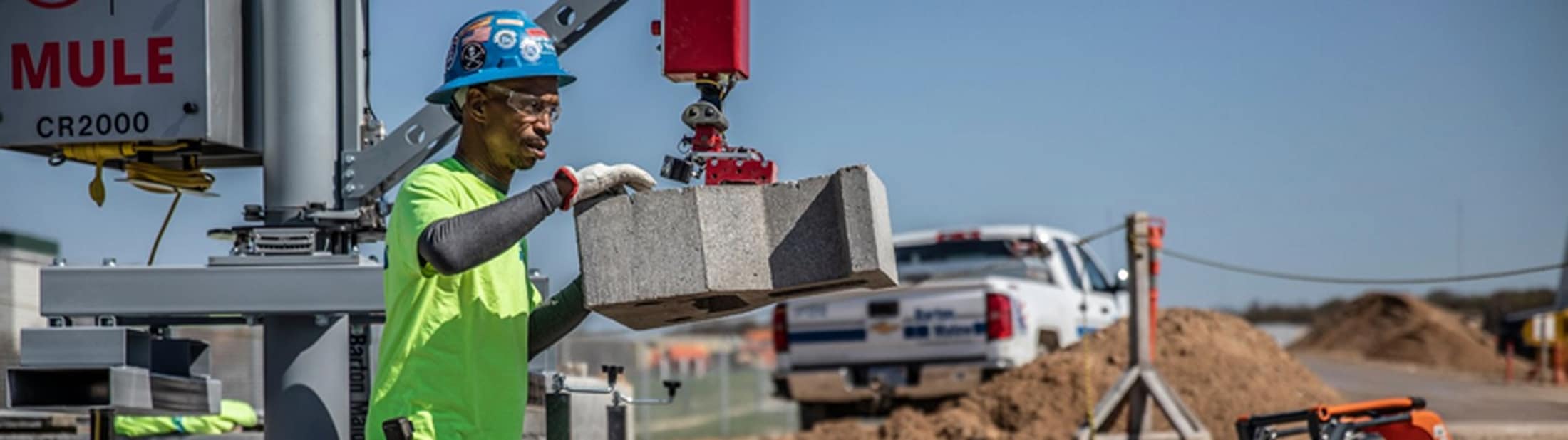 Barton Malow already uses simple robots on some job sites, such as the MULE, which helps workers place retaining wall block. The firm is a collaborator on a $2M, U-M led project that aims to enable robots to learn from and cooperate with human construction workers. Photo: Construction Robotics