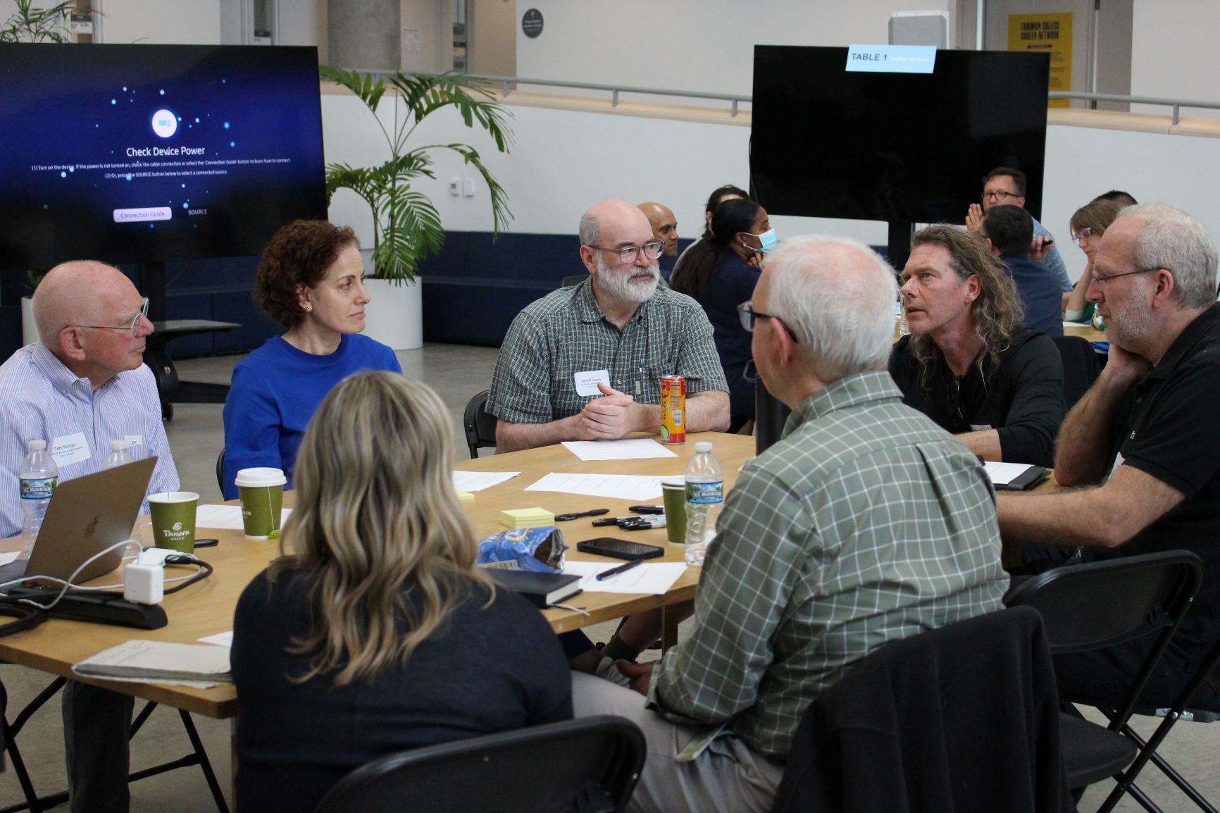 Image of Cross-unit teams discuss low carbon initiatives at a June 15 workshop.