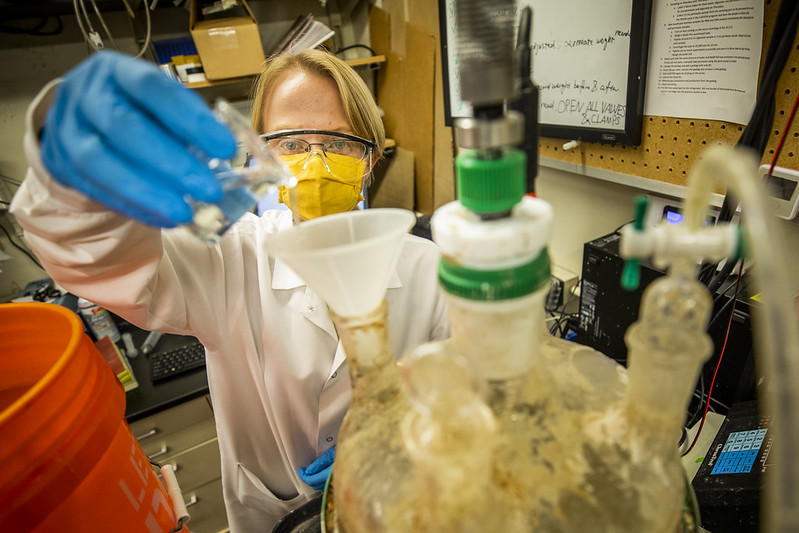 Renata Rae Strarostka, a CEE graduate research assistant, works on a new biodigester that converts organic solid waste from trash and wastewater into renewable methane inside 89 EWRB 