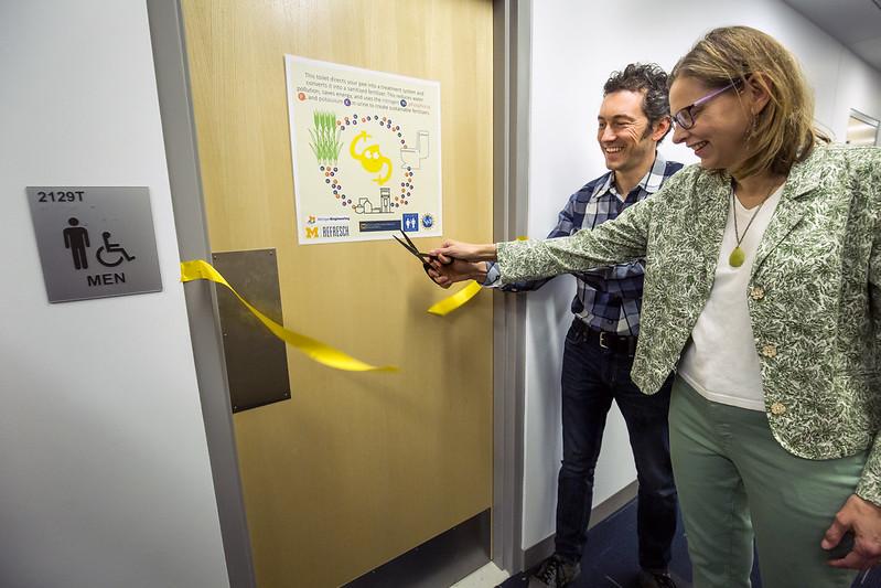 Abe Noe-Hays, Rich Earth Institute Director, and Nancy Love, Borchardt and Glysson Collegiate Professor and Professor of Civil and Environmental Engineering, cut the ribbon at the opening of a special urine-diverting toilet and urinal as part a research project to turn urine into fertilizer in the G.G. Brown Building on North Campus of the University of Michigan in Ann Arbor, MI on January 24, 2017.