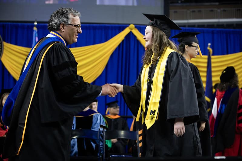 Image from convocation on a student receiving scholarship