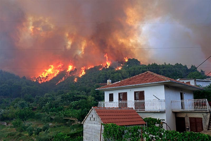 Zrnovnica, Split, Croatia - July 17, 2017: Massive wildfire burning down the forest and villages around city Split